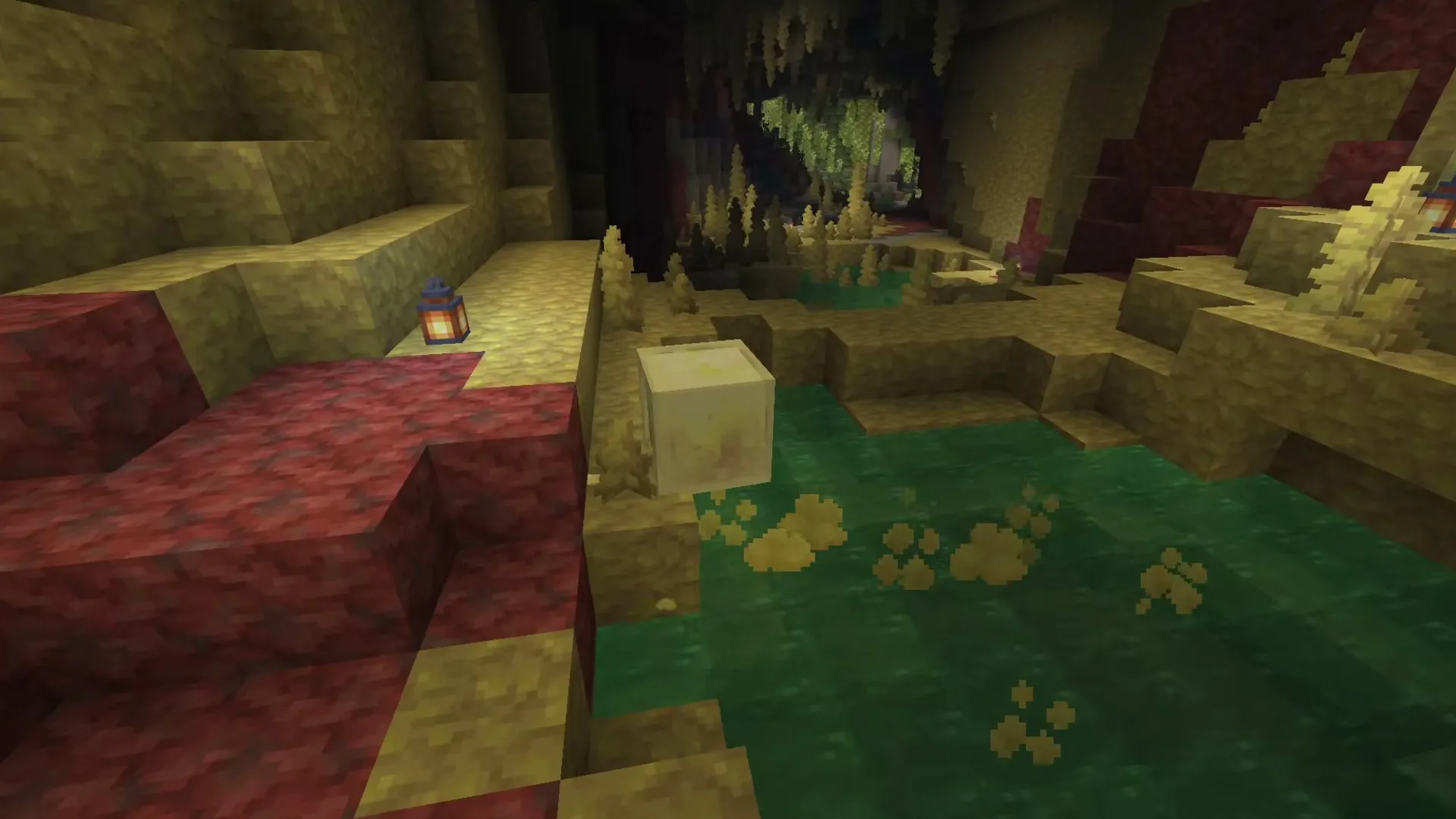 Inside a sulfur cave: yellow sulfur, red cinnabar and a green pool