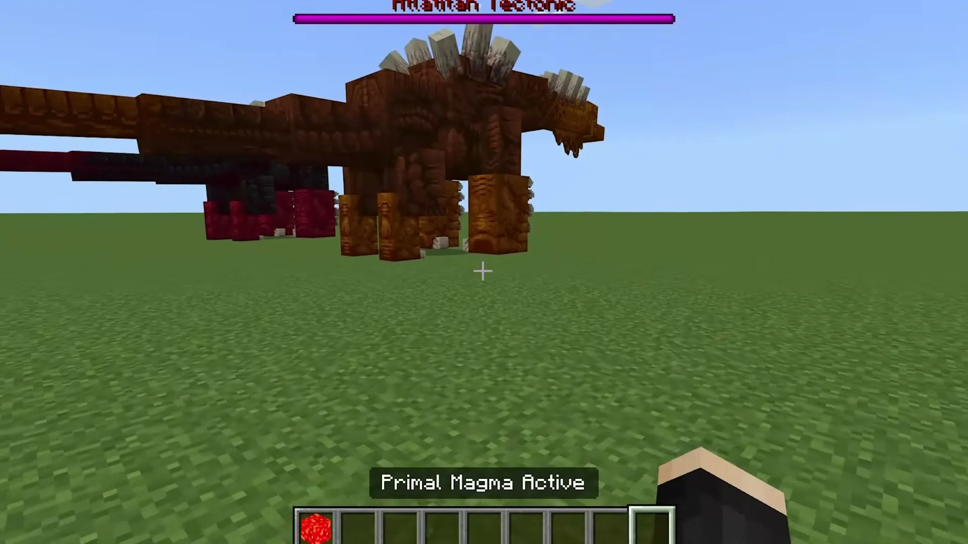 Alex's Caves addon: Primal Magma Active dragon in grassy field