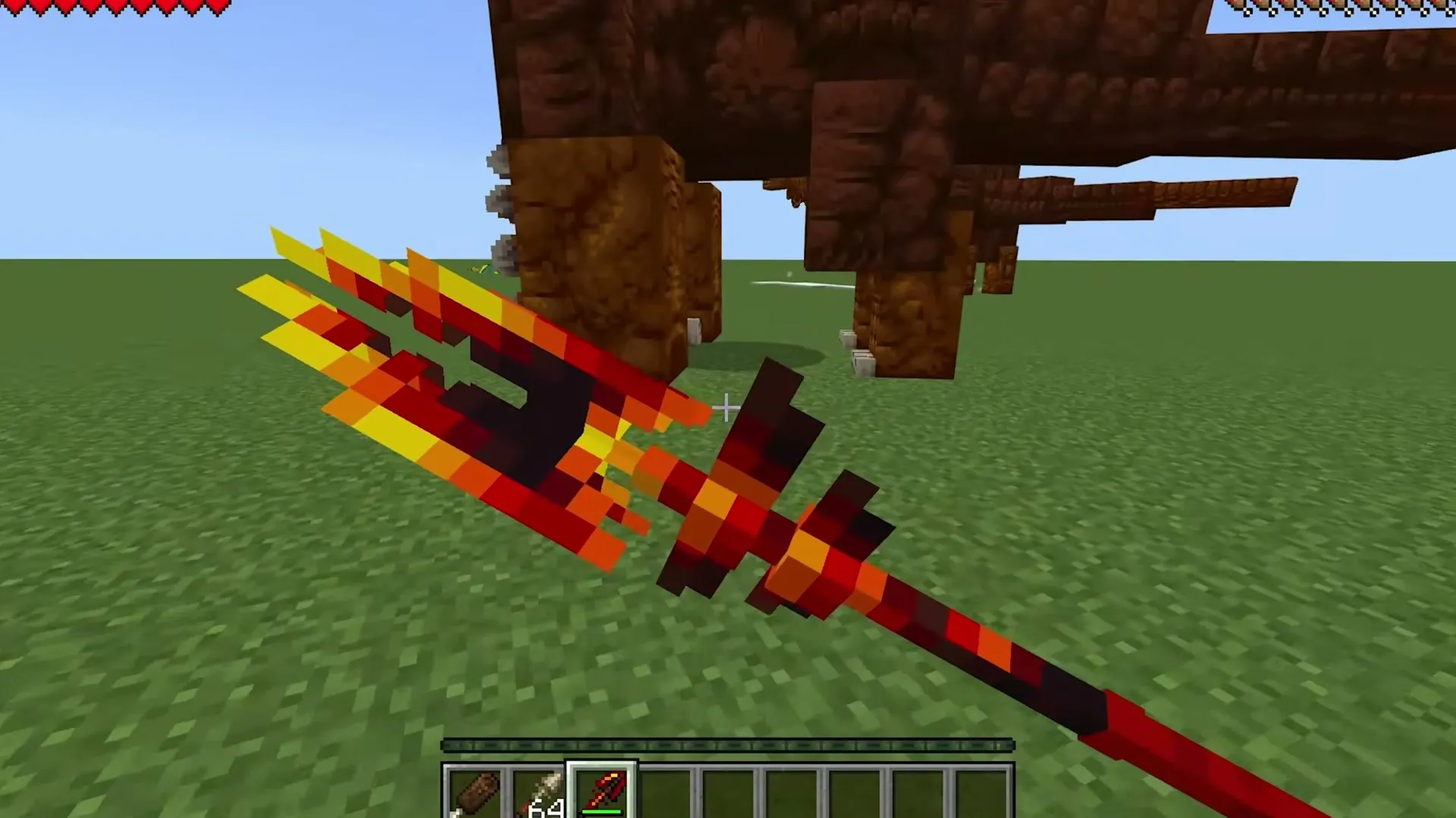 Alex's Caves addon: Player holding fiery sword near giant creature