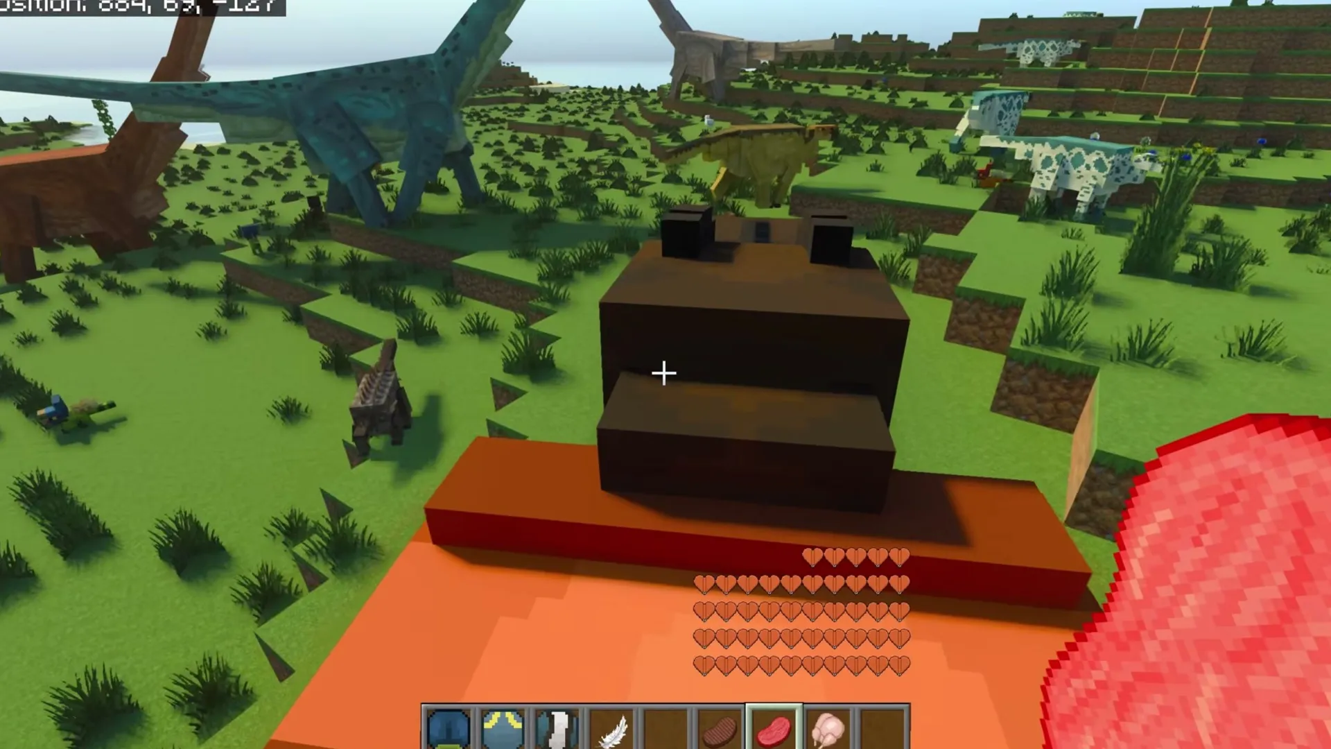 Prehistoric Utopia addon: Player standing on red platform with dinosaur models around