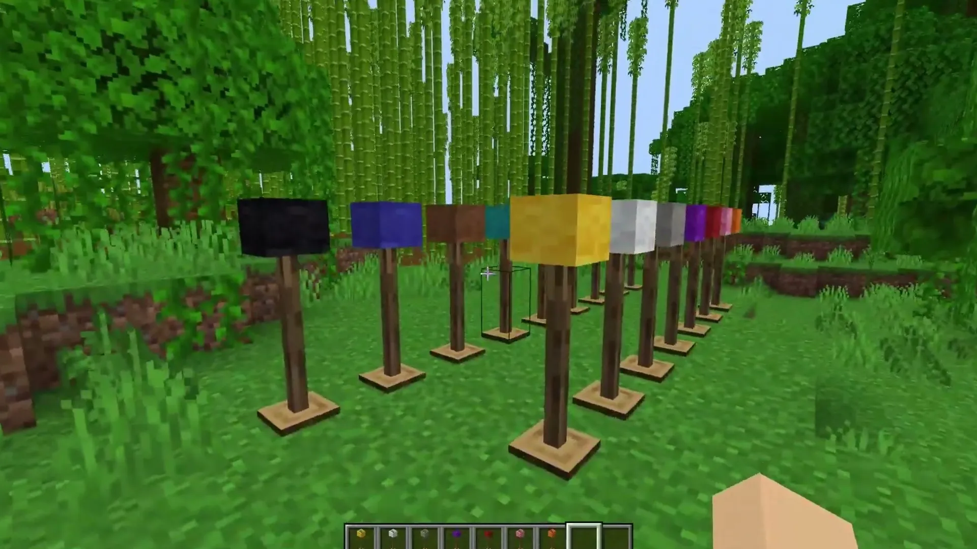 Rynnn's Furniture addon: Colorful blocks on wooden stands in a forest