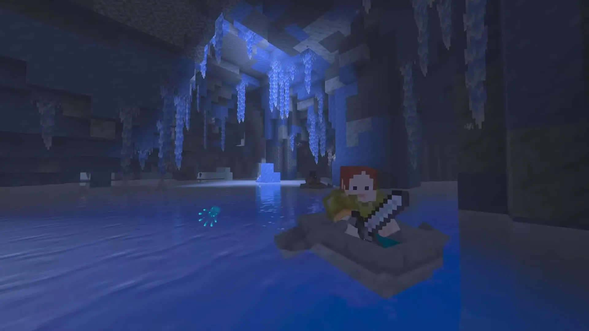 A player in a boat in a new ice cave