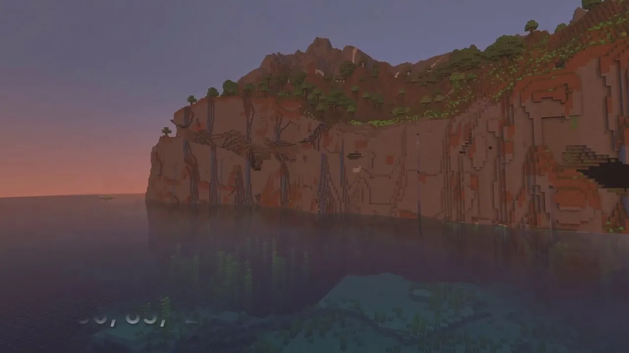 Terracotta Badlands Cliffs Bordering Deep Coral Formations: Badlands cliff wall rising above clear coastal water with visible coral