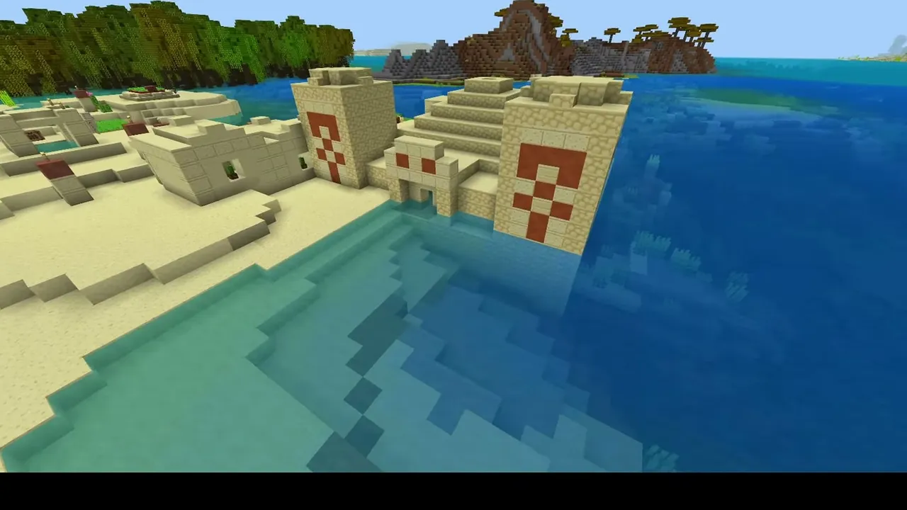 Coastal Temple Desert Village: closer view of a desert temple and sandstone houses sitting in the shallow shoreline water