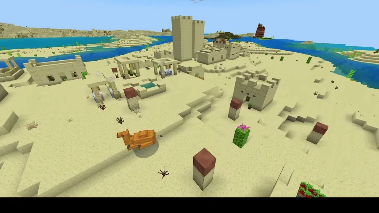 Dune Valley Village: closer view of sandstone village houses, a camel, and farm plots on the sand