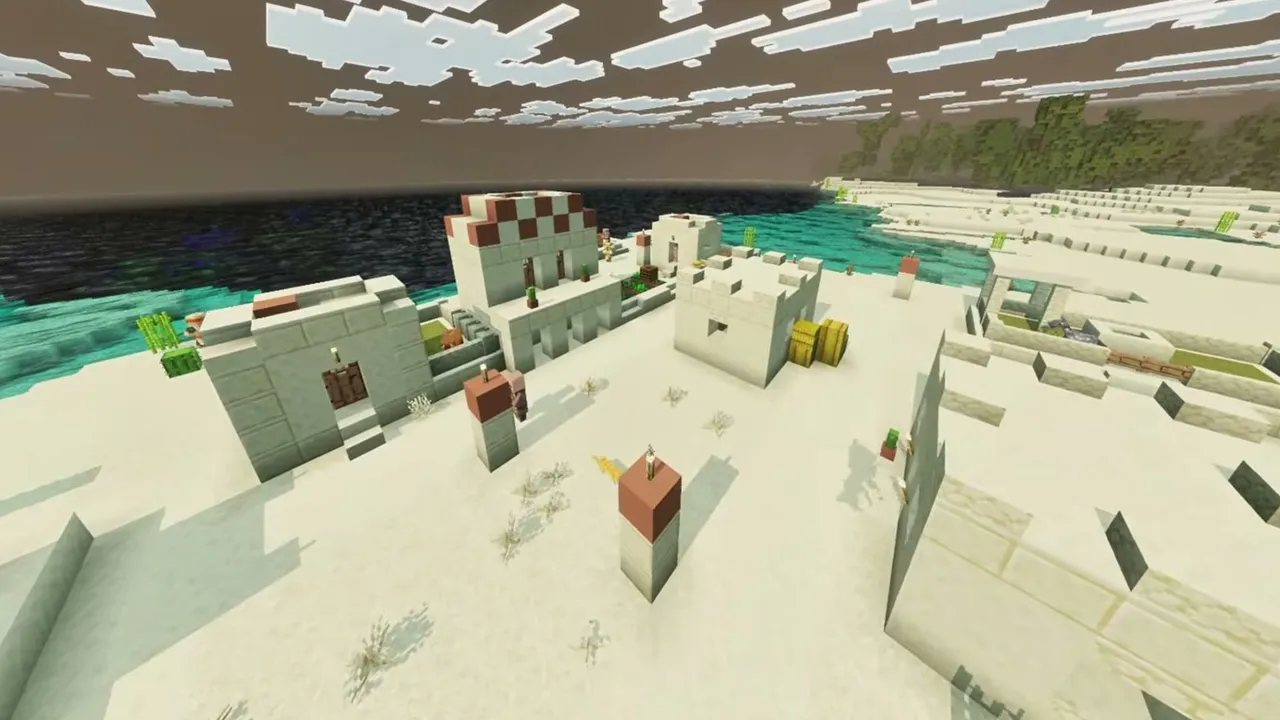Ocean Shoreline Desert Village: closer view of sandstone village houses and hay bales along the ocean shoreline