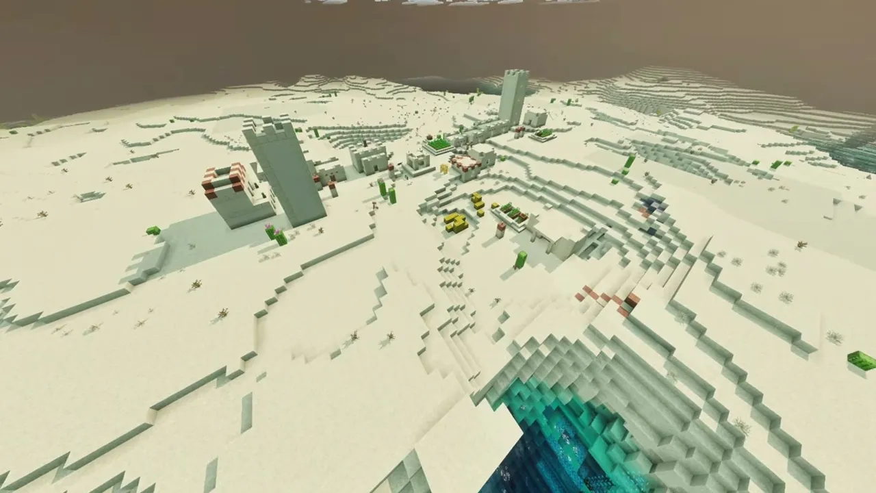 Sinkhole Desert Village: wide aerial view of a desert village bordering a deep water-filled sinkhole