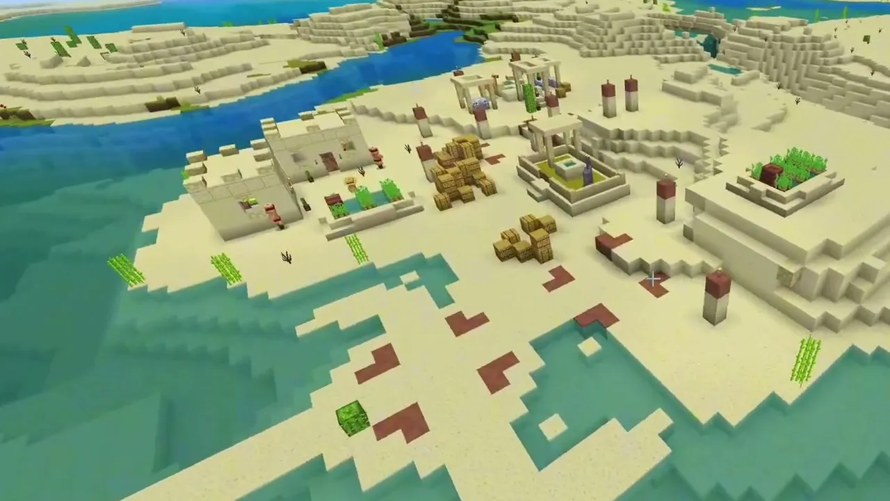 River Bay Village and Temple: wide overhead view of a coastal desert village with hay bales and farms along a bay