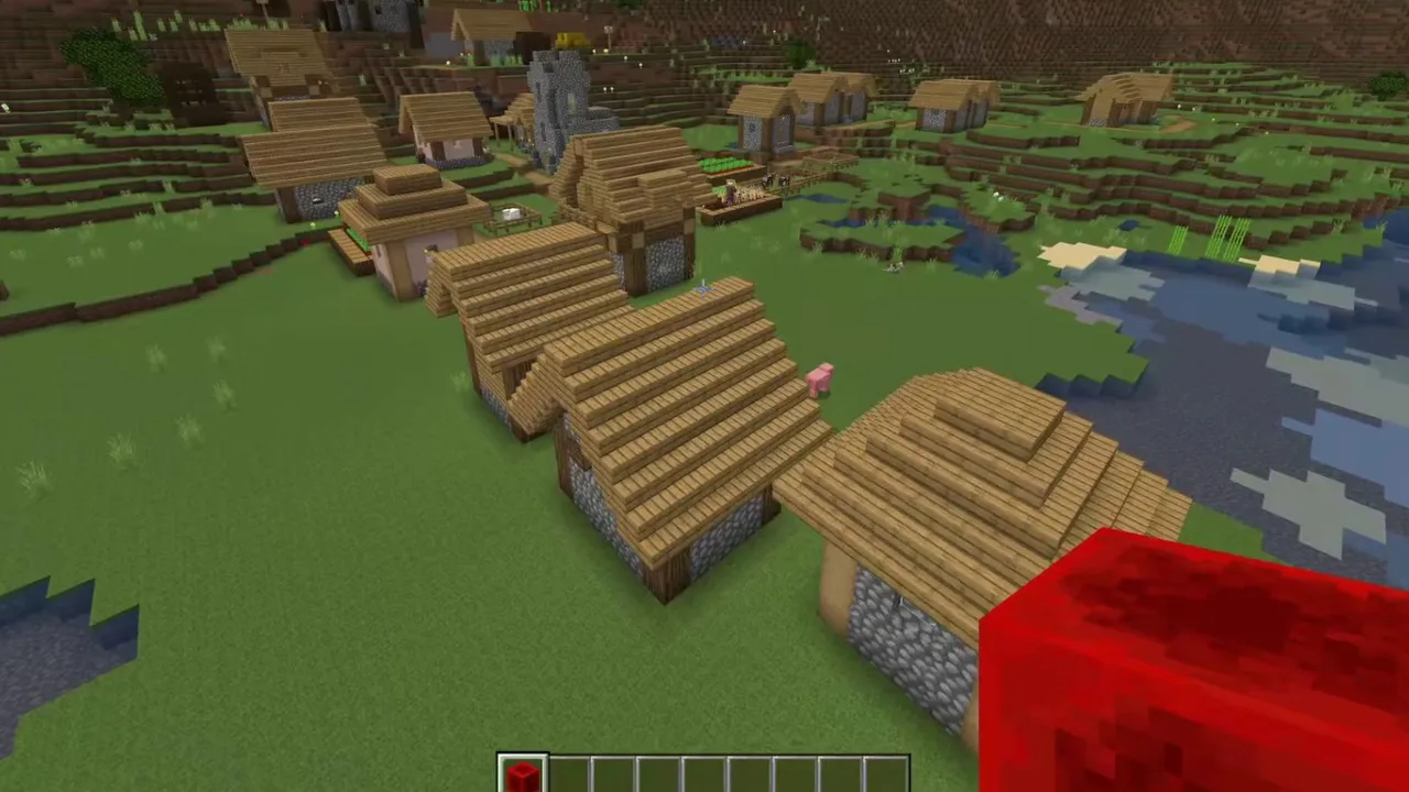 Watchtower Village Spawn: Pillager watchtower standing beside village cabins