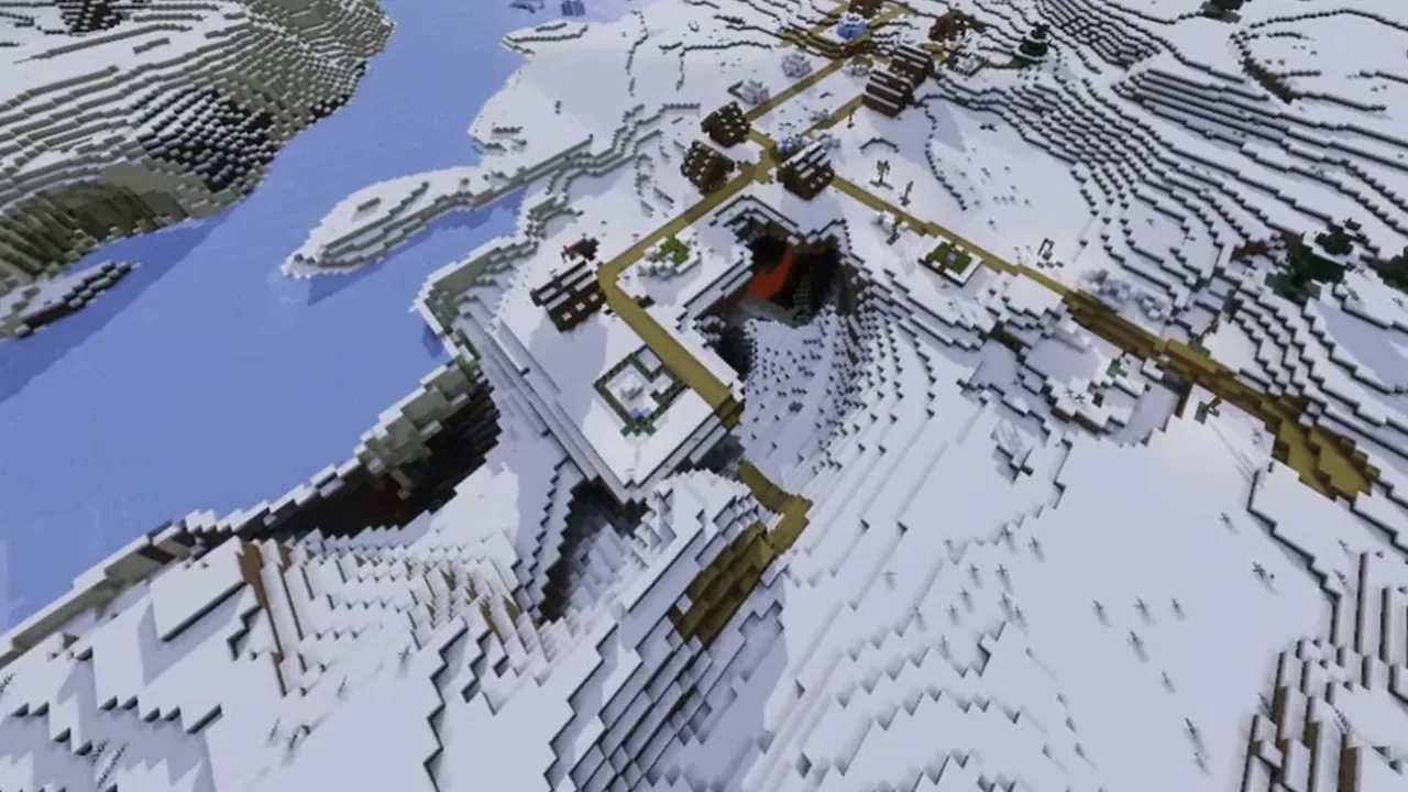 Coastal Snow Ridge Village Split by Ravine: Closer look at village houses perched along the edge of the snowy ravine