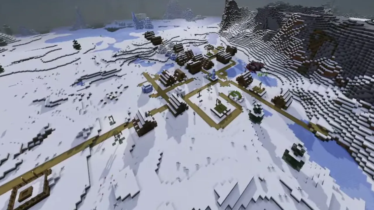 Snowy Hillside Village Beside Stone Cliffs: Closer view of intersecting roads and snow-covered houses on the slope