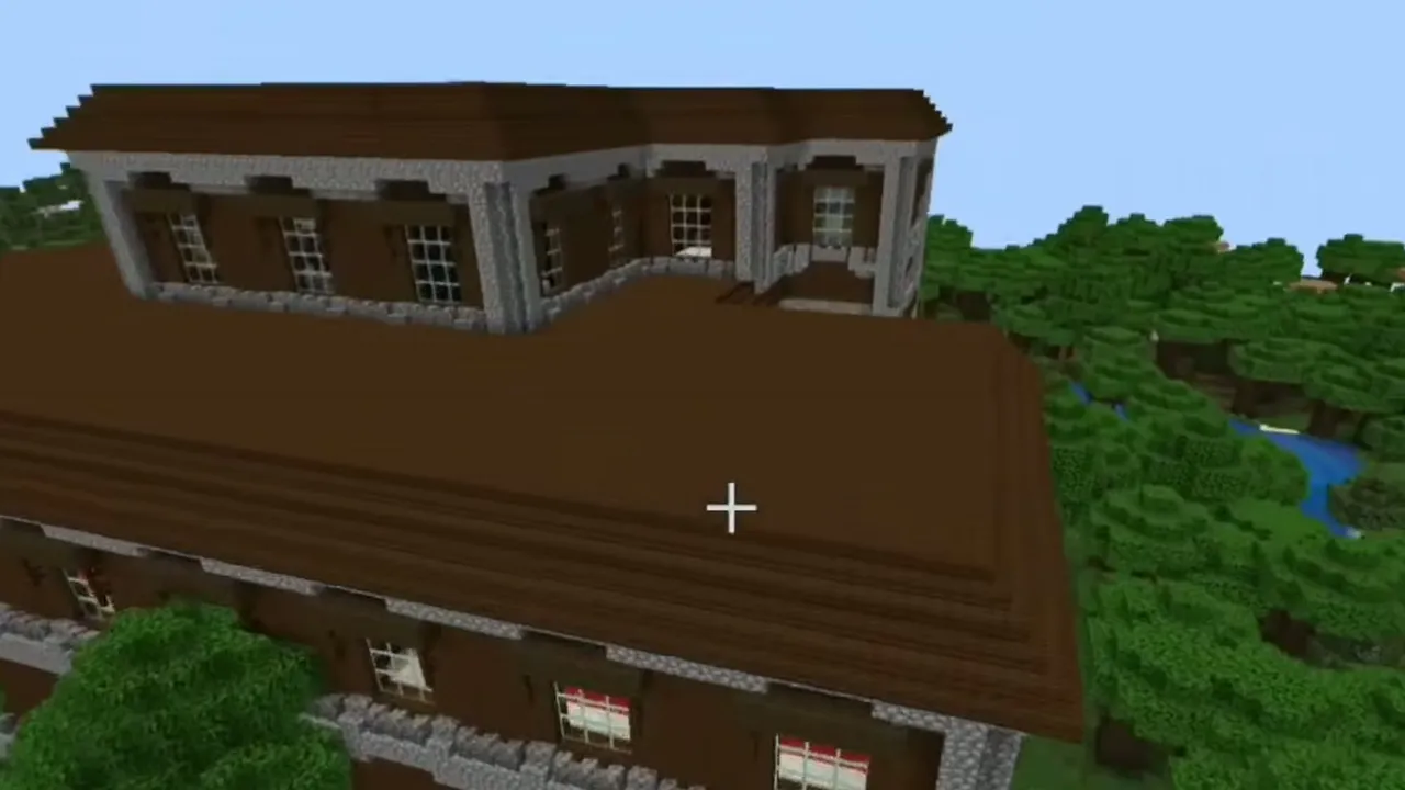 Woodland Mansion and Jungle Clearing Trail Ruins: Dark oak roof and upper windows of a woodland mansion surrounded by forest trees