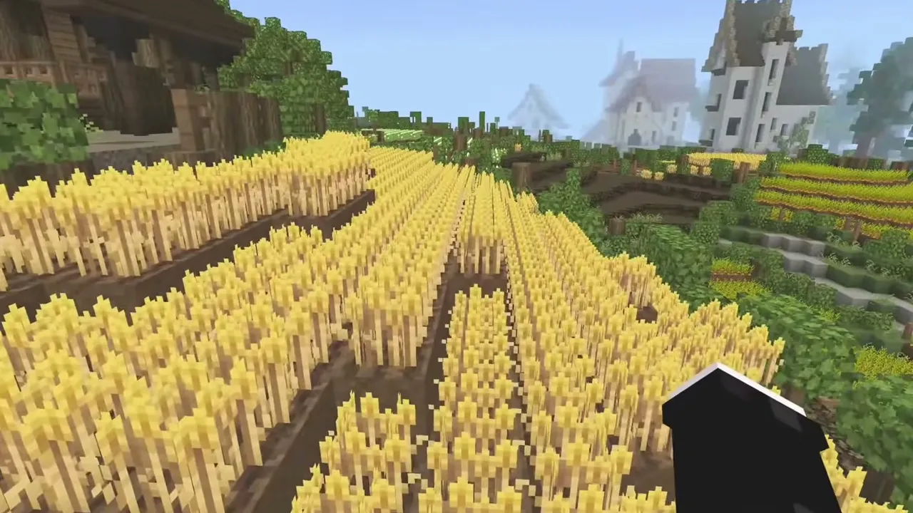 Mizuno's 16 Craft texture pack for Minecraft PE: Golden wheat field with village in background