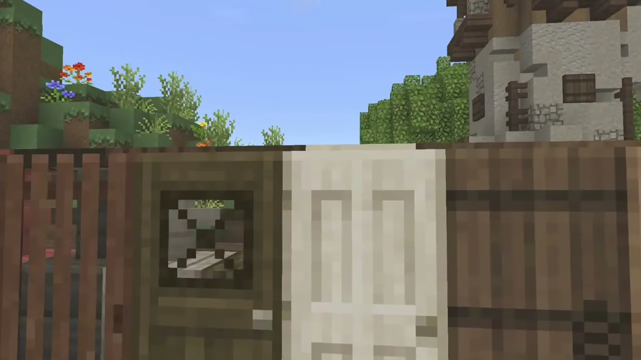 Mizuno's 16 Craft texture pack: Village with wooden fence and stone house